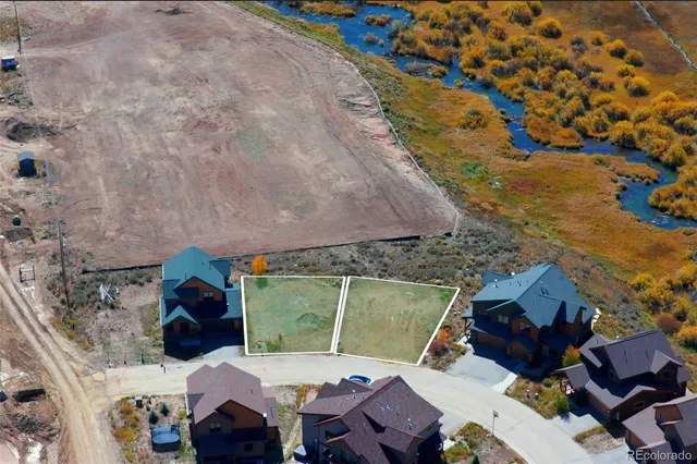 an aerial view of a house with a yard
