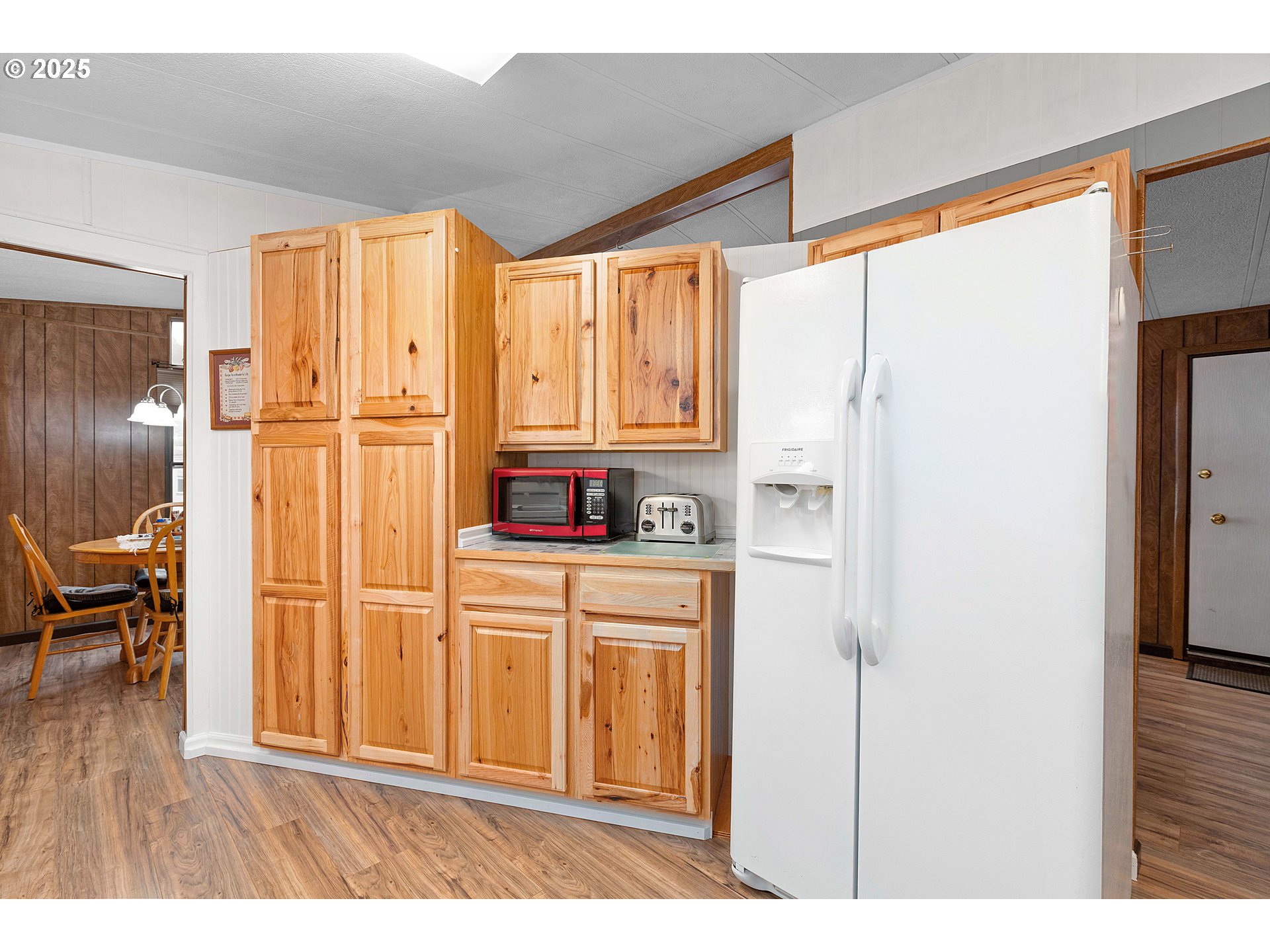 406 Shadow Ranch Lane Roseburg, OR 97470 - Photo 13 of 32 a kitchen with stainless steel appliances a refrigerator and a window