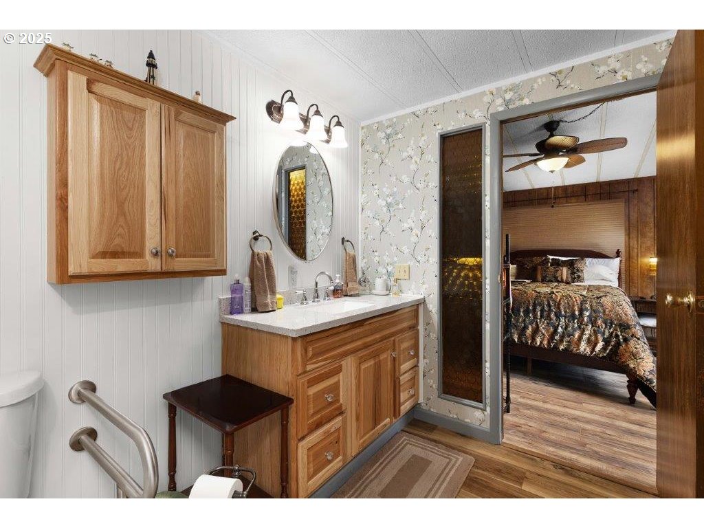 406 Shadow Ranch Lane Roseburg, OR 97470 - Photo 24 of 32 a en suite bathroom with a sink and mirror