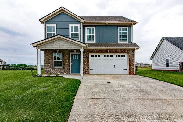 a front view of a house with a yard