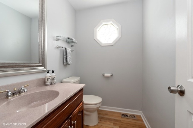 3561 Ronald Road Crete, IL 60417 - Photo 14 of 18 a bathroom with a granite countertop sink and a mirror
