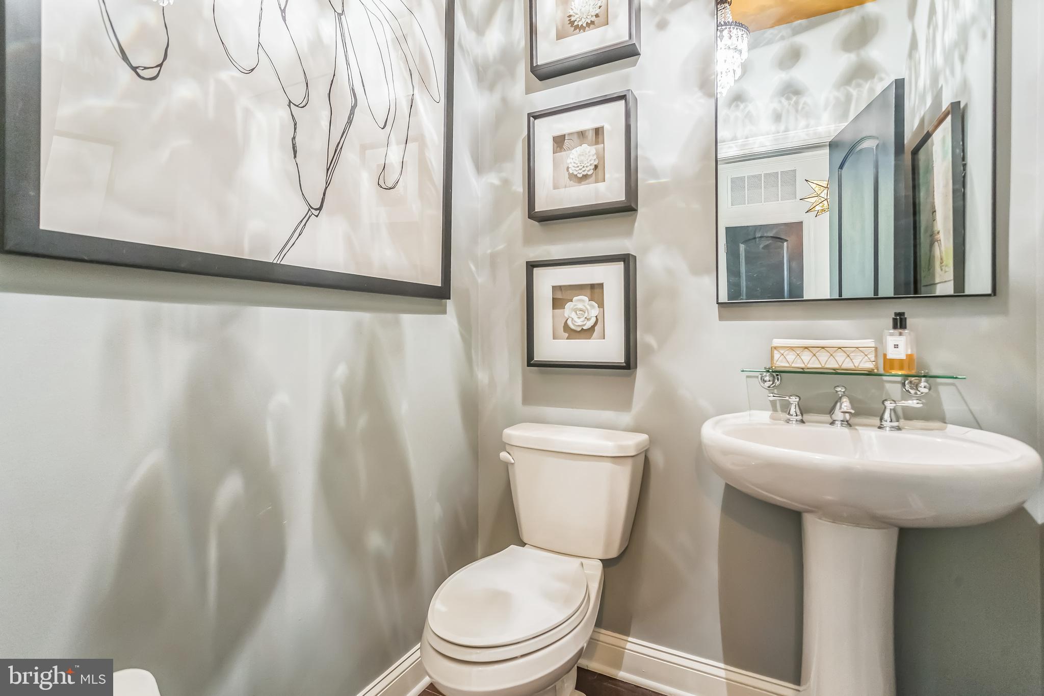 52 David Drive Newtown, PA 18940 - Photo 12 of 32 a bathroom with a toilet sink and mirror