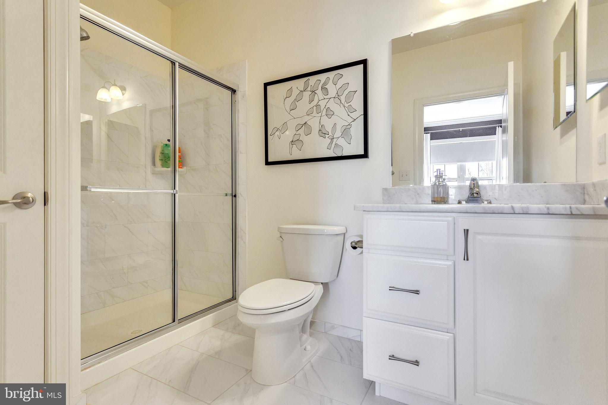 52 David Drive Newtown, PA 18940 - Photo 23 of 32 a bathroom with a granite countertop toilet sink and shower