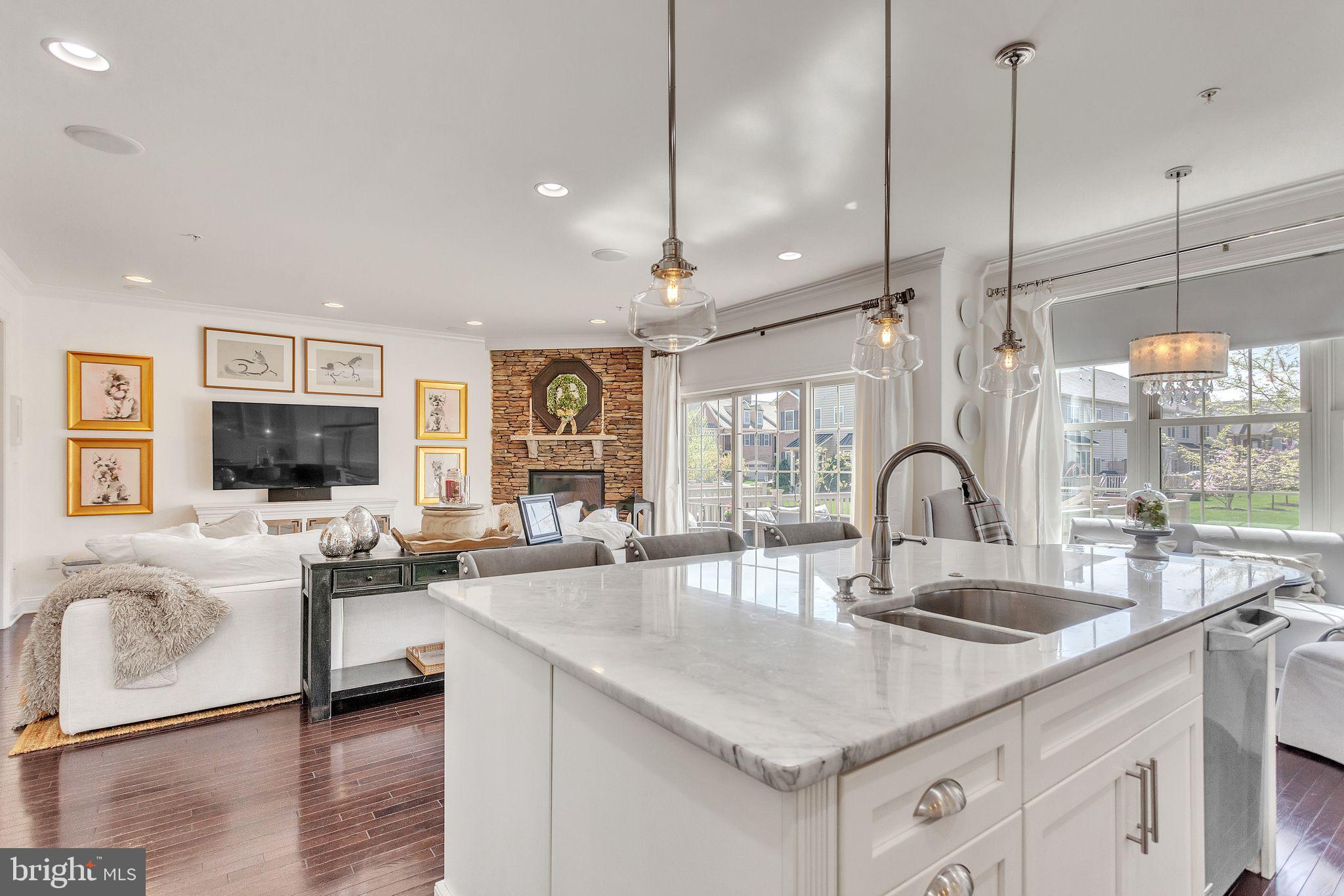 52 David Drive Newtown, PA 18940 - Photo 9 of 32 a kitchen with stainless steel appliances granite countertop a sink a stove and a wooden floor