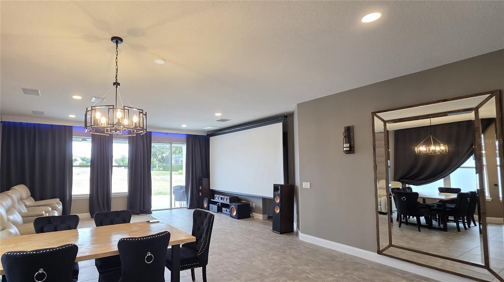 5531 Cypress Hill Road Winter Garden, FL 34787 - Photo 11 of 62 a view of a dining room with furniture and chandelier