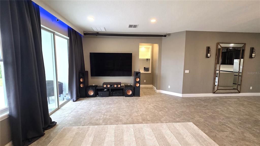 5531 Cypress Hill Road Winter Garden, FL 34787 - Photo 14 of 62 a living room with furniture and a flat screen tv