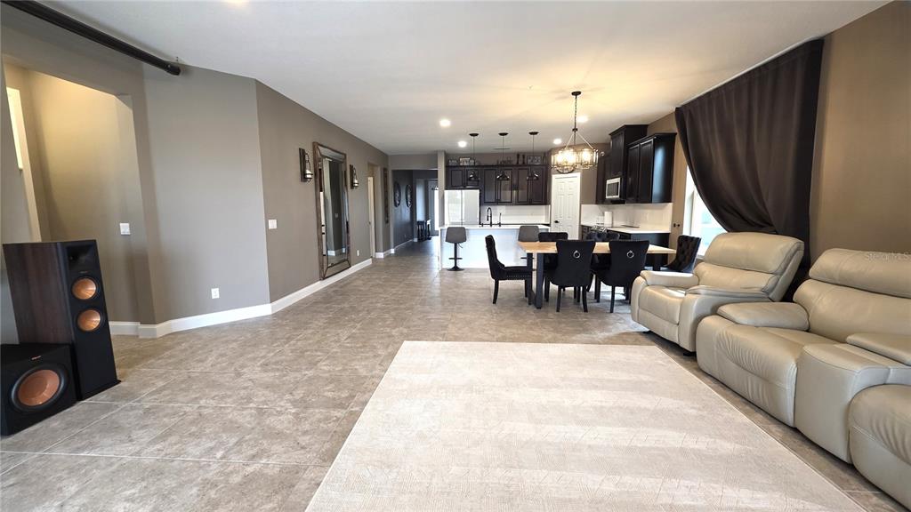 5531 Cypress Hill Road Winter Garden, FL 34787 - Photo 16 of 62 a living room with furniture a window and a flat screen tv