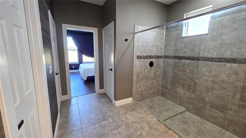 5531 Cypress Hill Road Winter Garden, FL 34787 - Photo 22 of 62 a bathroom with a shower and a sink