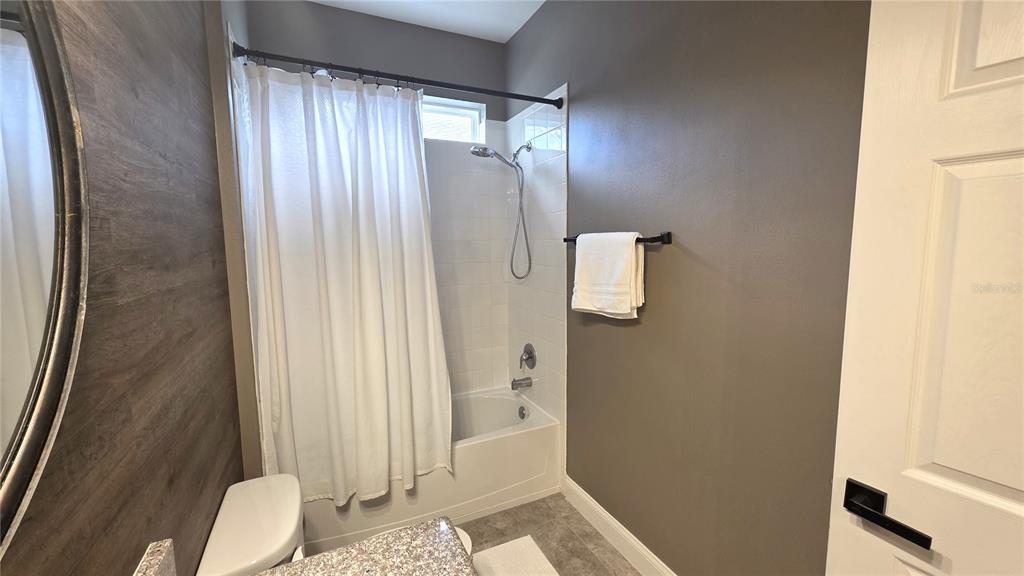 5531 Cypress Hill Road Winter Garden, FL 34787 - Photo 35 of 62 a bathroom with a sink and mirror