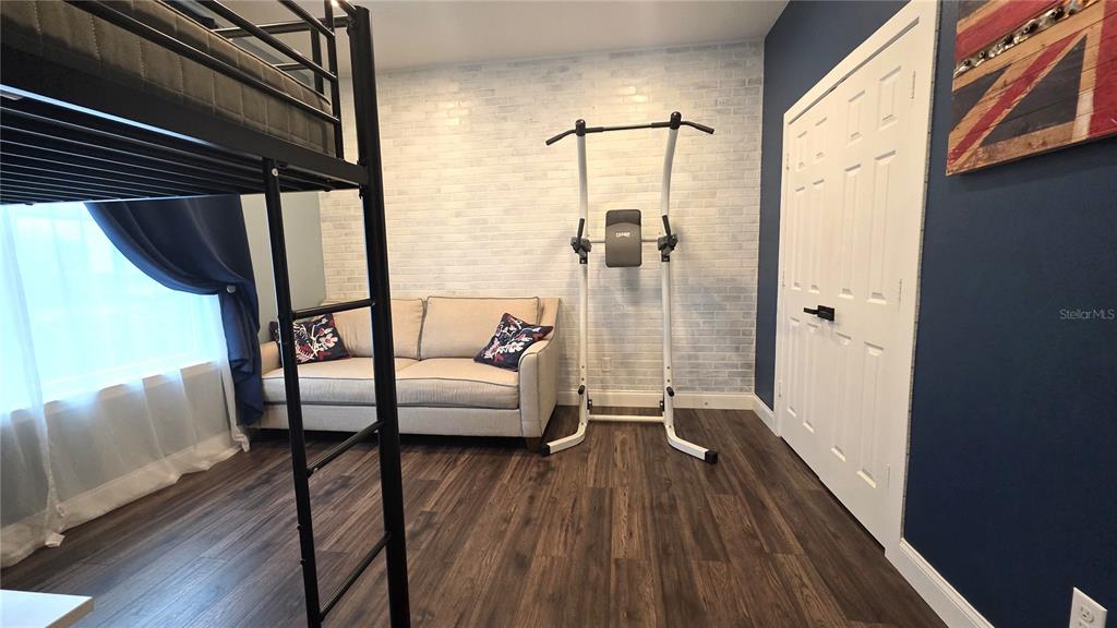 5531 Cypress Hill Road Winter Garden, FL 34787 - Photo 40 of 62 a living room with furniture and a wooden floor