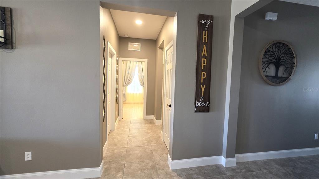 5531 Cypress Hill Road Winter Garden, FL 34787 - Photo 43 of 62 a view of hallway with livingroom and wooden floor
