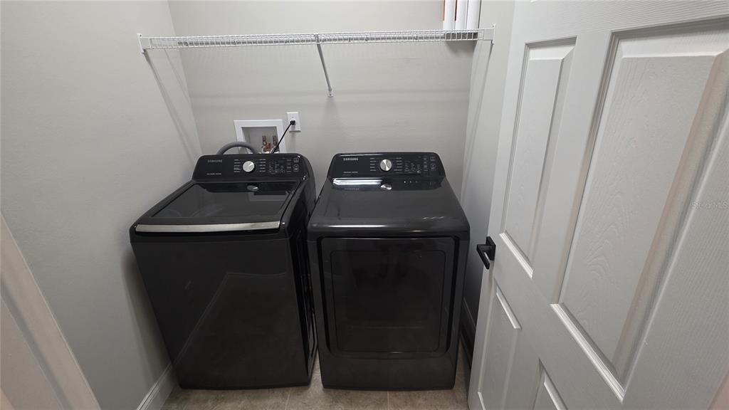 5531 Cypress Hill Road Winter Garden, FL 34787 - Photo 50 of 62 a close view of a utility room with dryer and washer