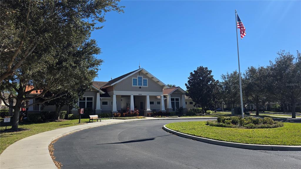 5531 Cypress Hill Road Winter Garden, FL 34787 - Photo 56 of 62 a front view of a house with a yard table and chairs