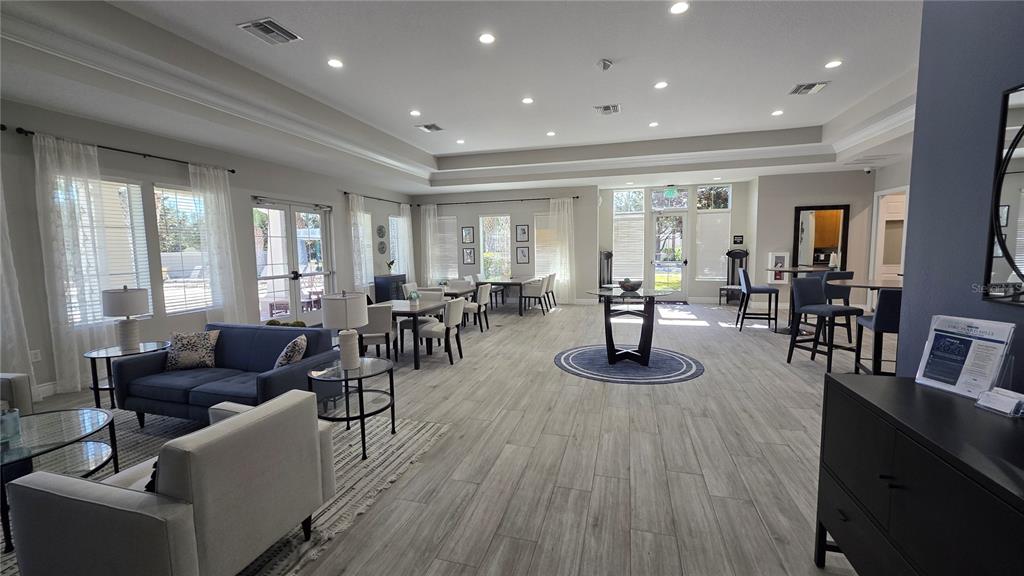 5531 Cypress Hill Road Winter Garden, FL 34787 - Photo 57 of 62 a living room with furniture and a wooden floor