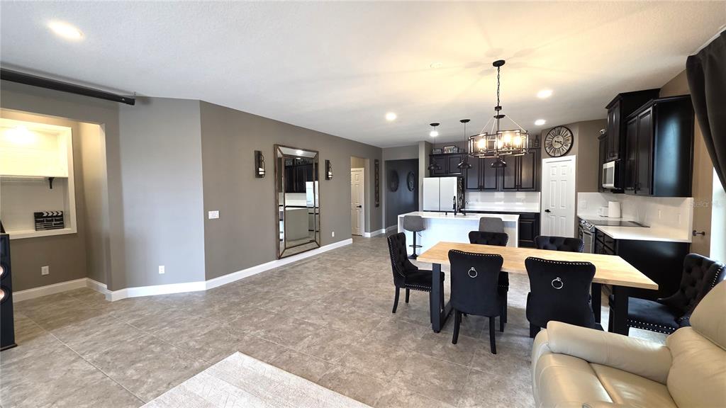 5531 Cypress Hill Road Winter Garden, FL 34787 - Photo 8 of 62 a large kitchen with a table and chairs