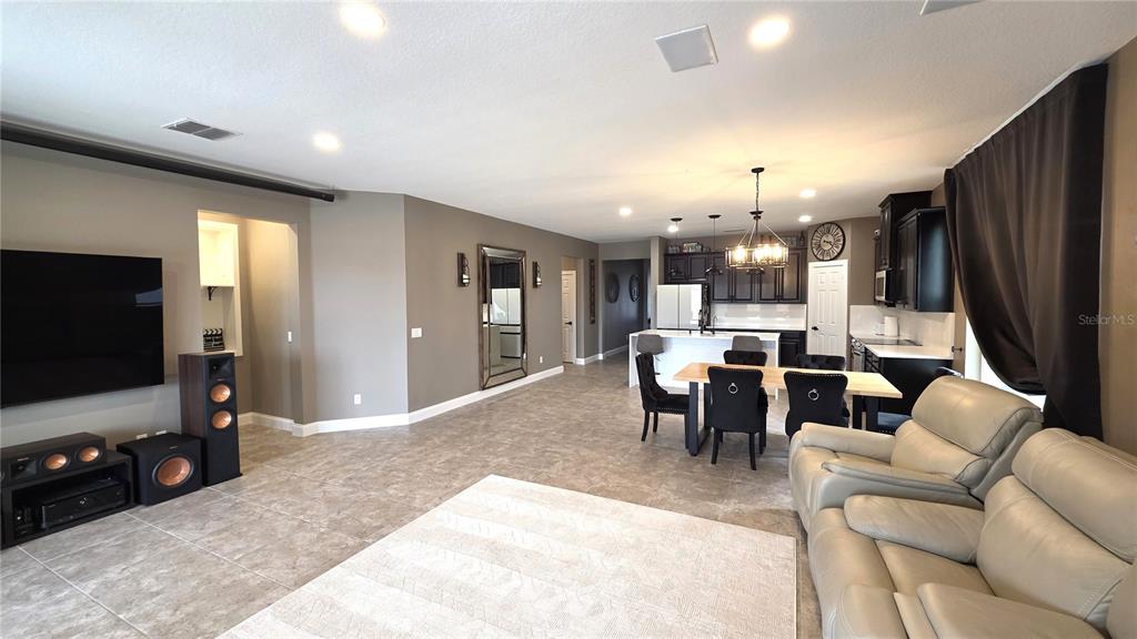 5531 Cypress Hill Road Winter Garden, FL 34787 - Photo 9 of 62 a living room with furniture and a flat screen tv