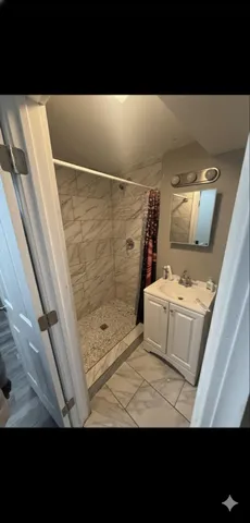 a bathroom with a sink and mirror