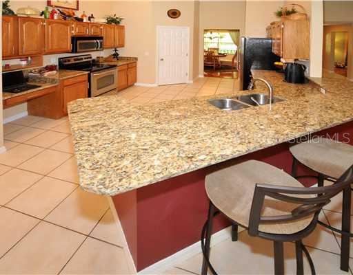 Kitchen - Granite countertops and stainless appliances all make this kitchen very open and functional.