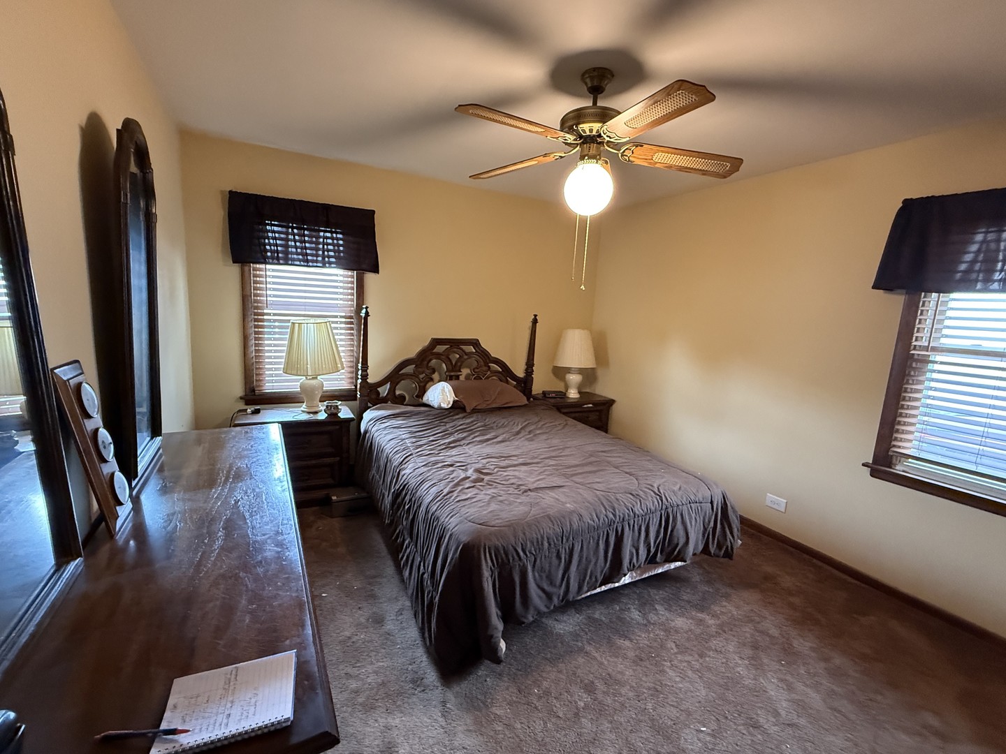 18316 Sherman Street Lansing, IL 60438 - Photo 11 of 14 a bedroom with a bed window and a flat screen tv