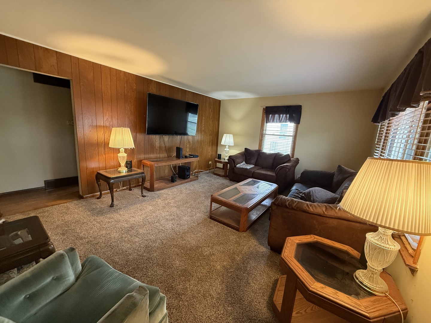 18316 Sherman Street Lansing, IL 60438 - Photo 2 of 14 a living room with furniture and a flat screen tv