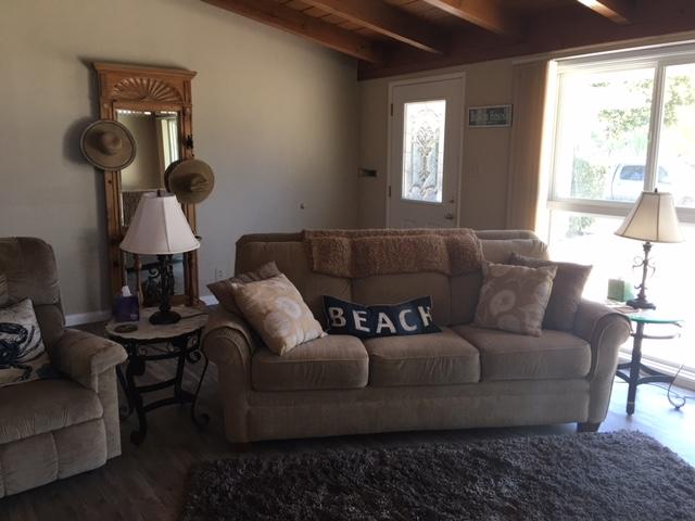 5610 Calle Pacific Carpinteria, CA 93013 - Photo 2 of 8 a living room with furniture and a window
