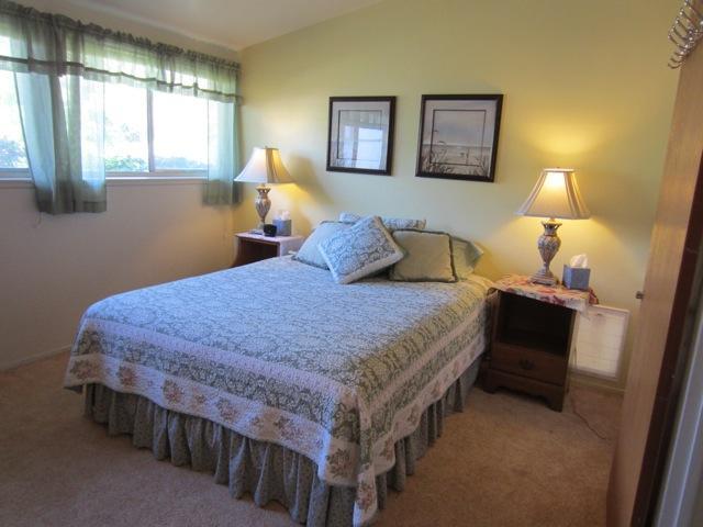 5610 Calle Pacific Carpinteria, CA 93013 - Photo 5 of 8 a bedroom with a bed and a lamp on dresser
