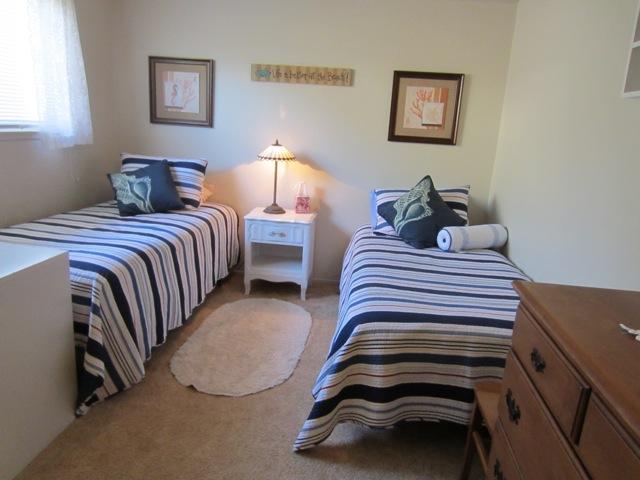 5610 Calle Pacific Carpinteria, CA 93013 - Photo 6 of 8 a bedroom with a bed and a lamp on table
