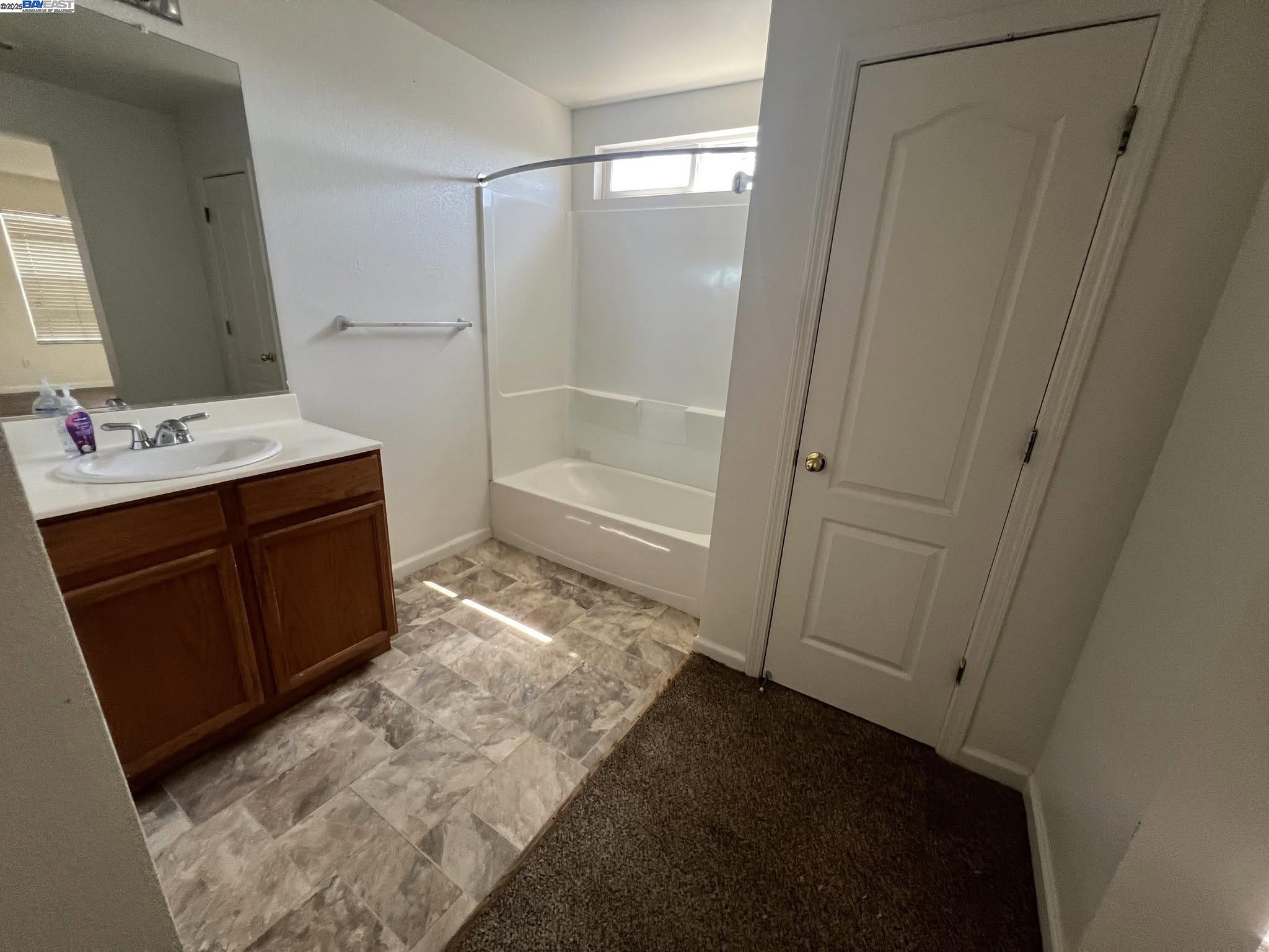3127 Puffin Circle Fairfield, CA 94533 - Photo 20 of 23 a bathroom with a sink and a mirror