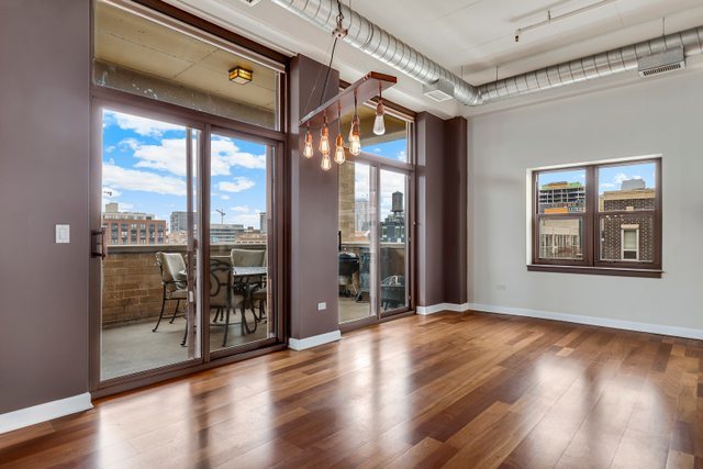 1301 West Madison Street, Unit 408 Chicago, IL 60607 - Photo 6 of 21 a view of an entryway with wooden floor