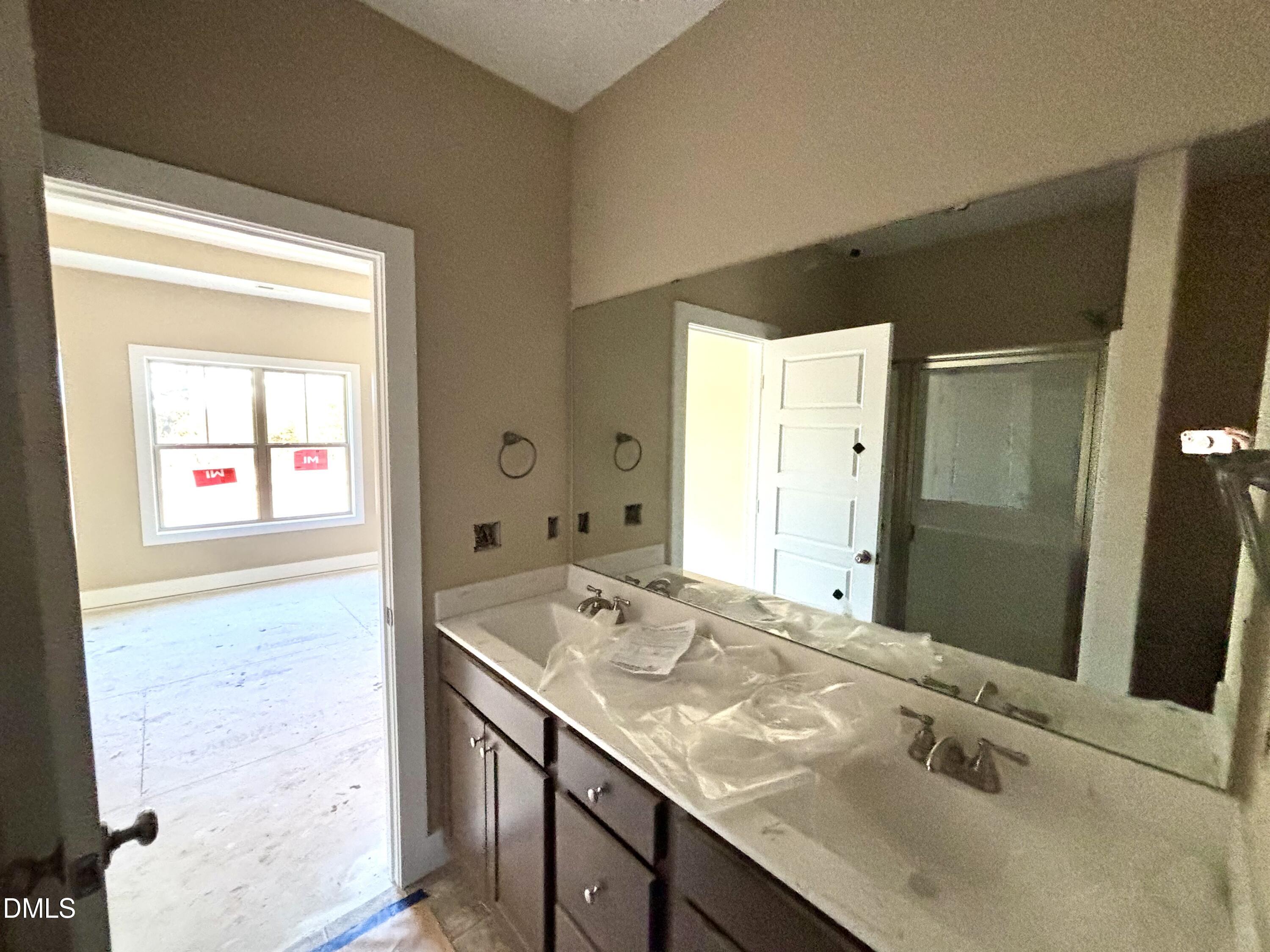 1448 Union Grove Church Road Fremont, NC 27830 - Photo 13 of 21 a bathroom with a granite countertop sink and a mirror