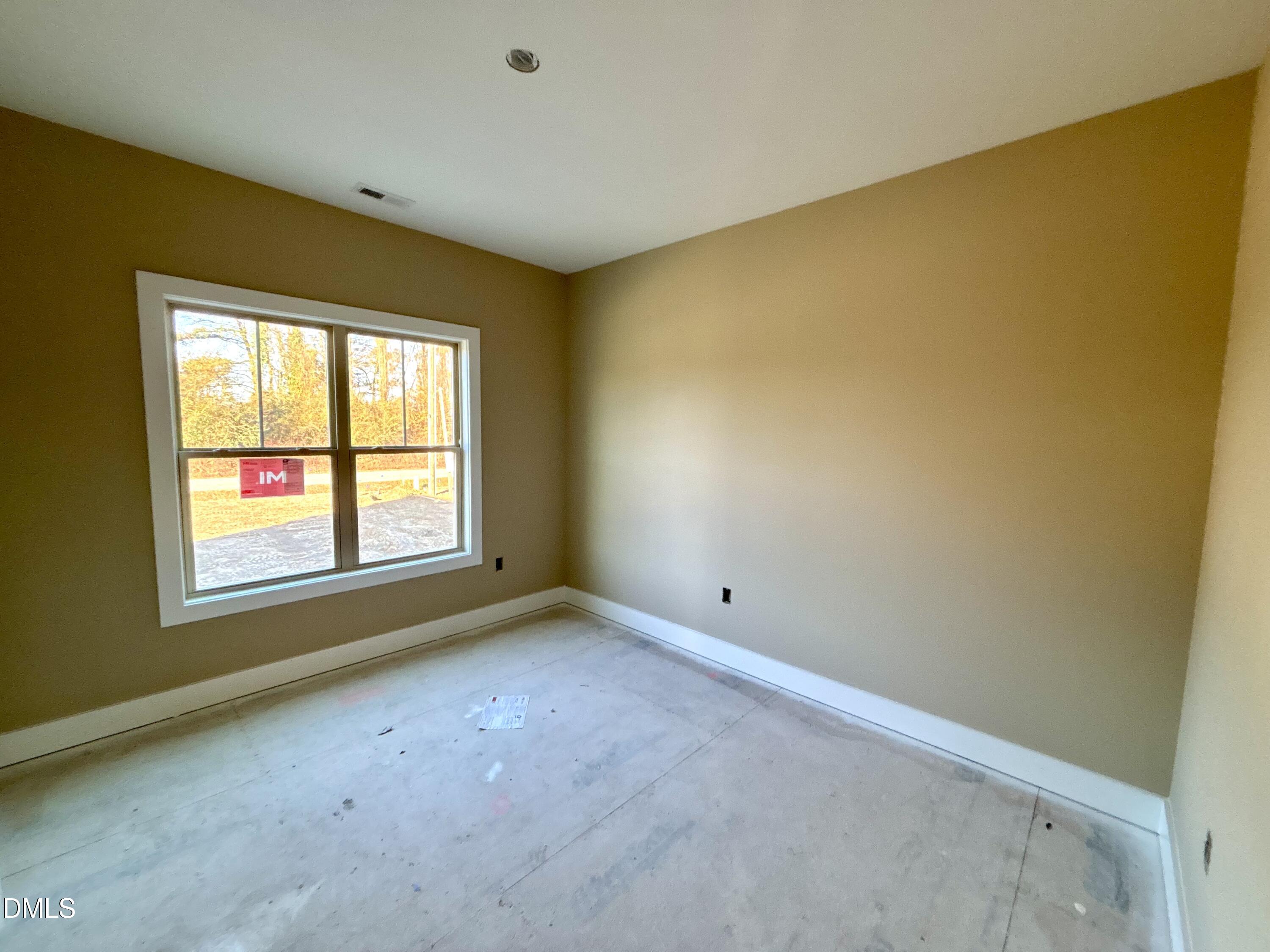 1448 Union Grove Church Road Fremont, NC 27830 - Photo 18 of 21 an empty room with a empty space and a window