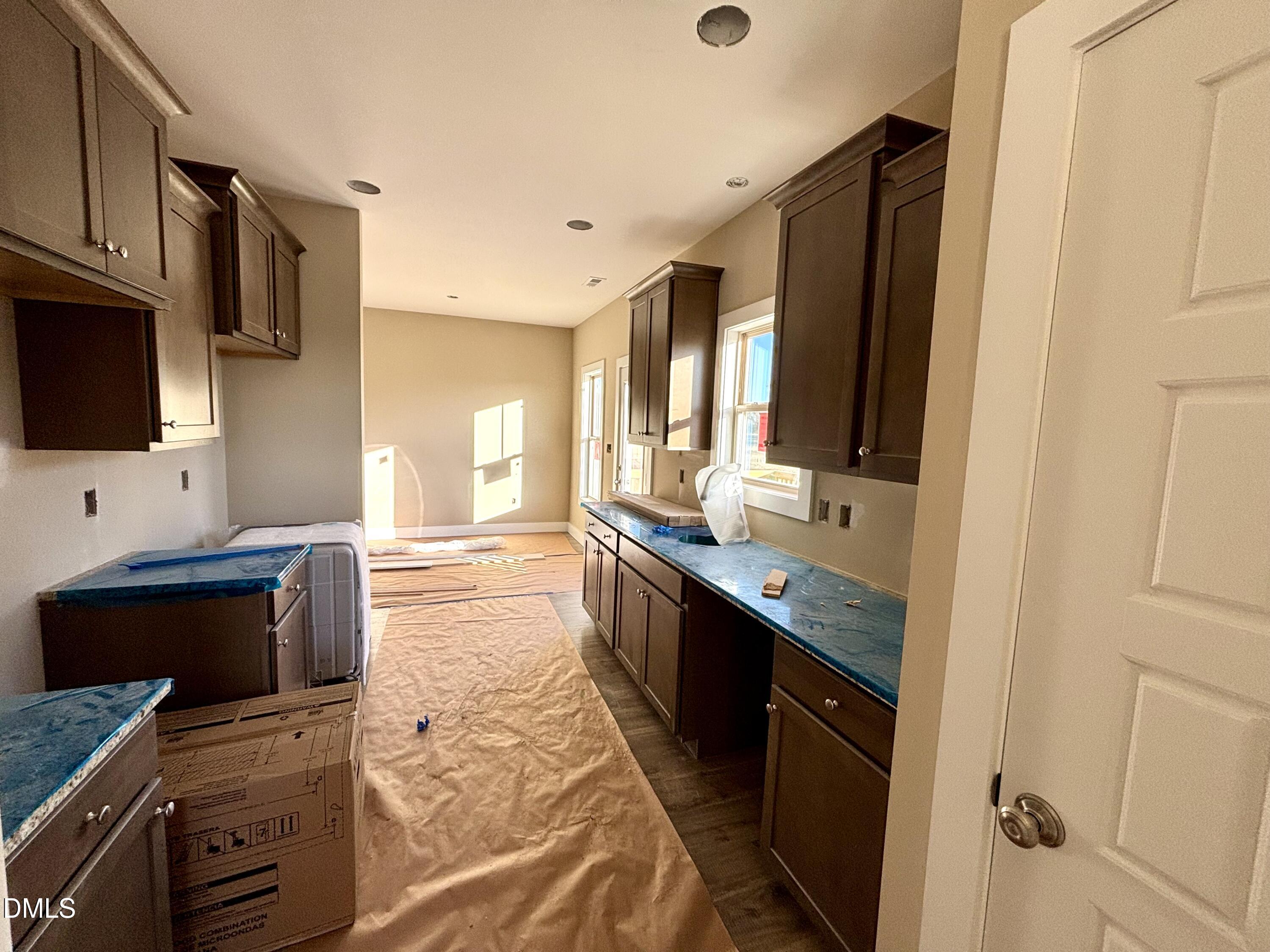 1448 Union Grove Church Road Fremont, NC 27830 - Photo 7 of 21 a kitchen with stainless steel appliances granite countertop a stove and a sink