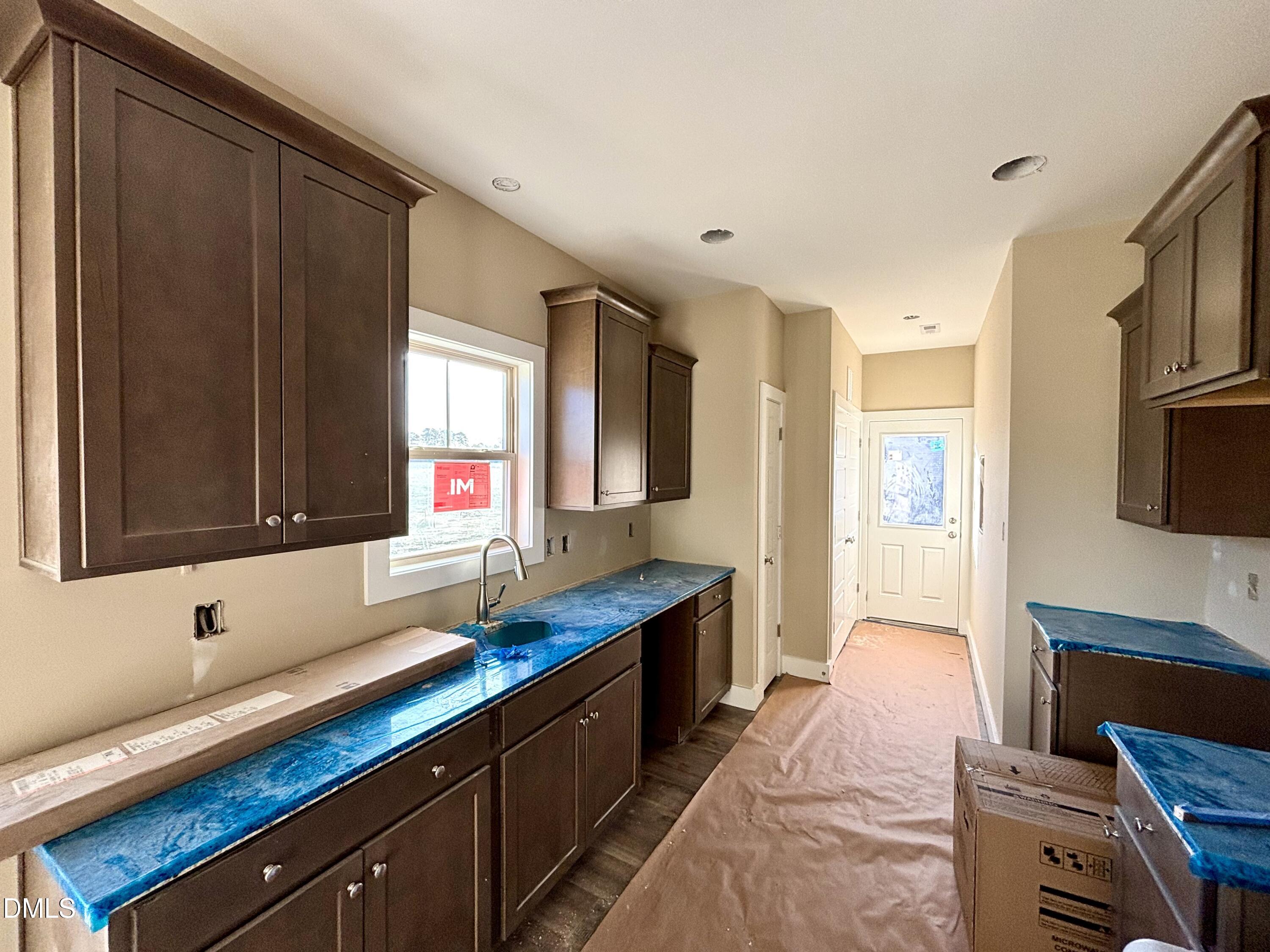 1448 Union Grove Church Road Fremont, NC 27830 - Photo 9 of 21 a kitchen with granite countertop a sink cabinets and window