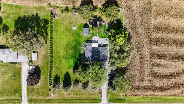 a front view of a house with a garden and porch
