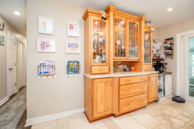 a living room with stainless steel appliances kitchen island granite countertop furniture and a kitchen view