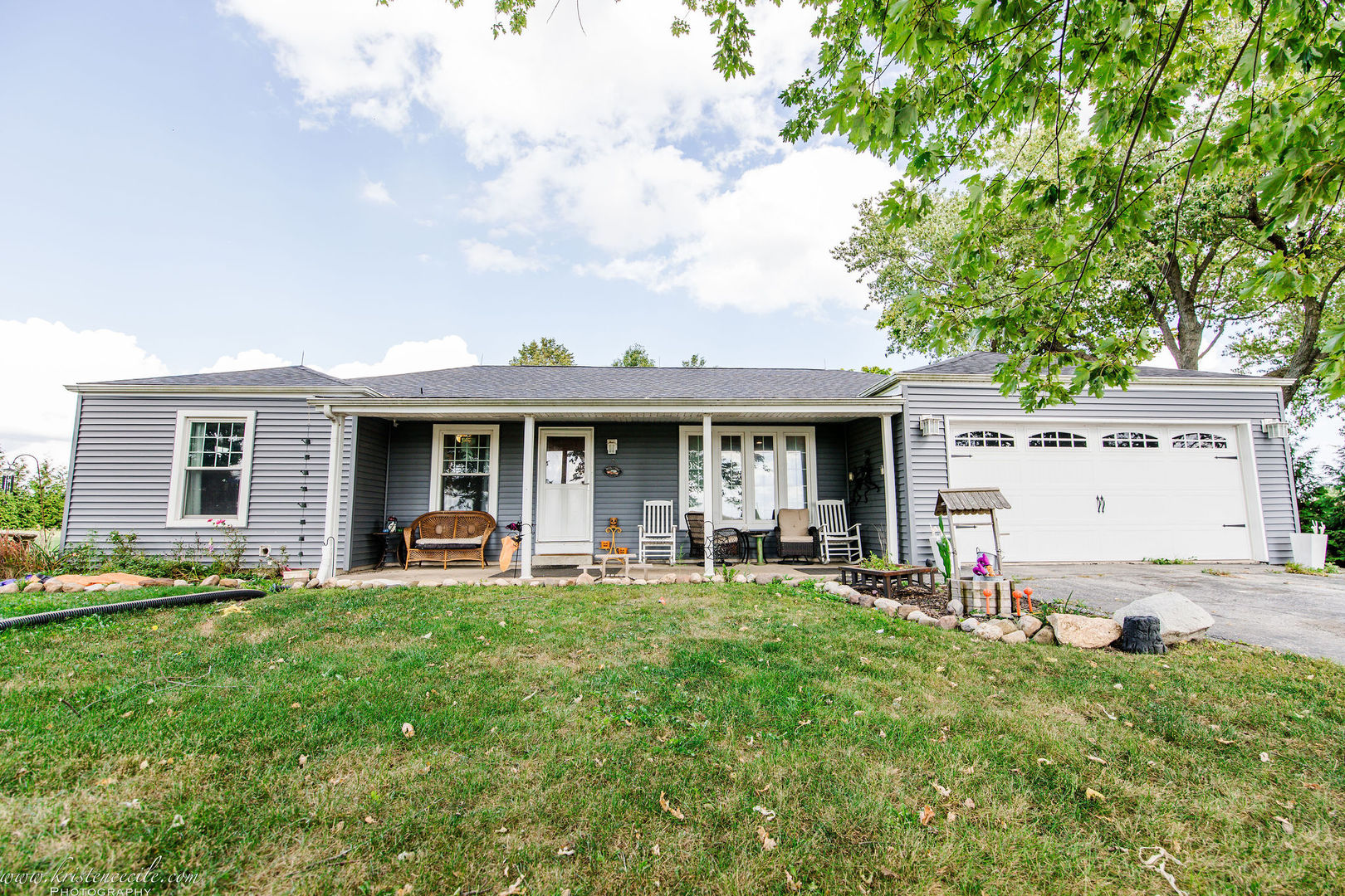 936 West Corning Road Beecher, IL 60401 - Photo 2 of 72 a front view of a house with a garden and porch