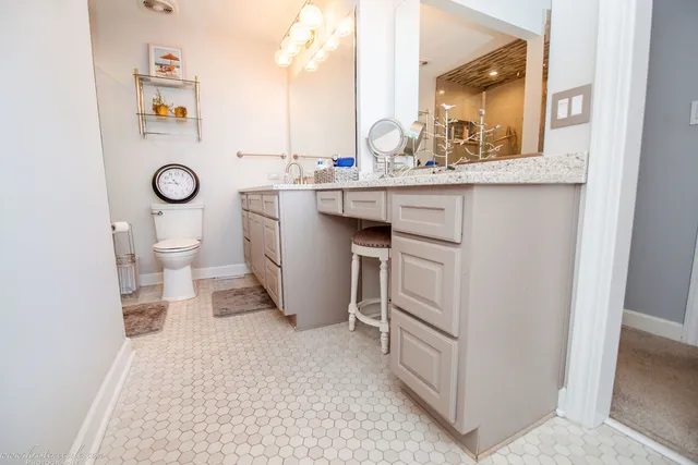 a view of backyard with table and chairs and large trees