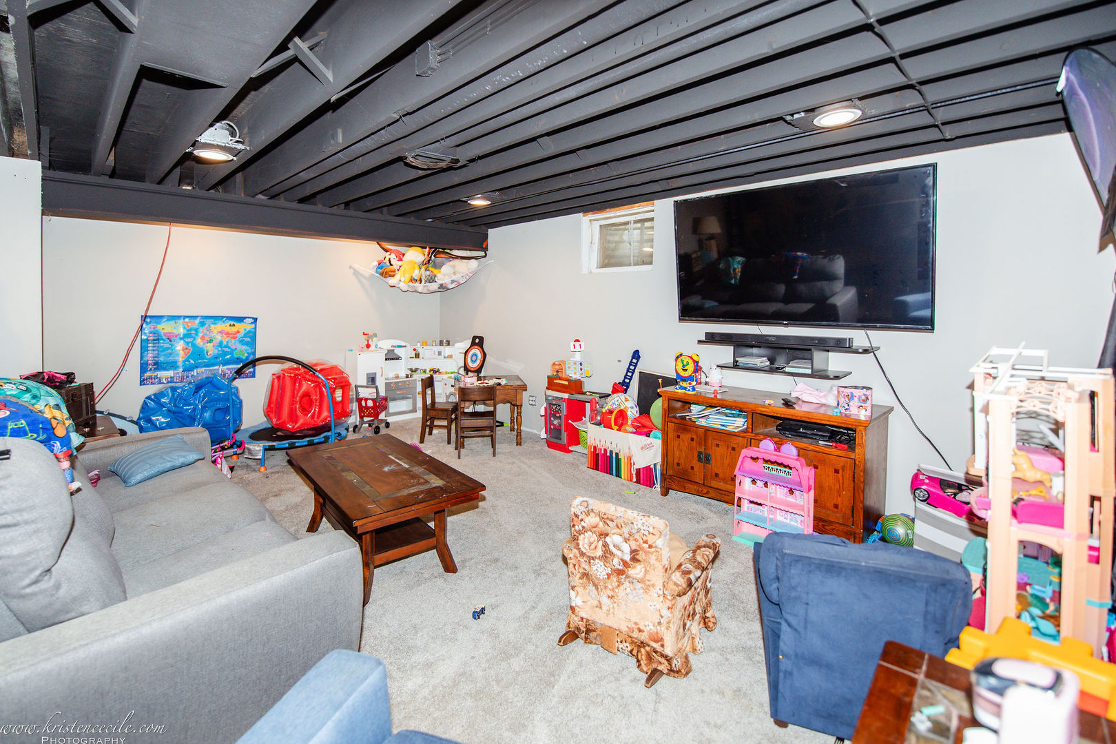 936 West Corning Road Beecher, IL 60401 - Photo 46 of 72 a living room with furniture and a flat screen tv