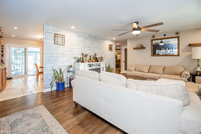 a view of a livingroom with furniture and a window