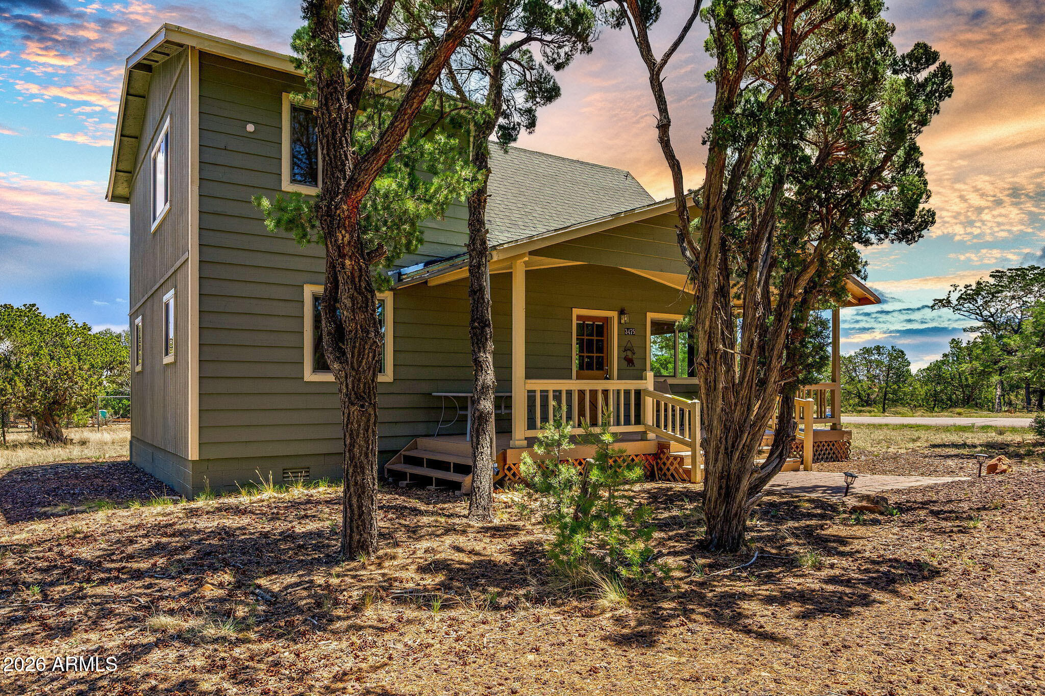 3475 Roundup Circle Heber, AZ 85928 - Photo 1 of 34 a house that has a tree in front of the house