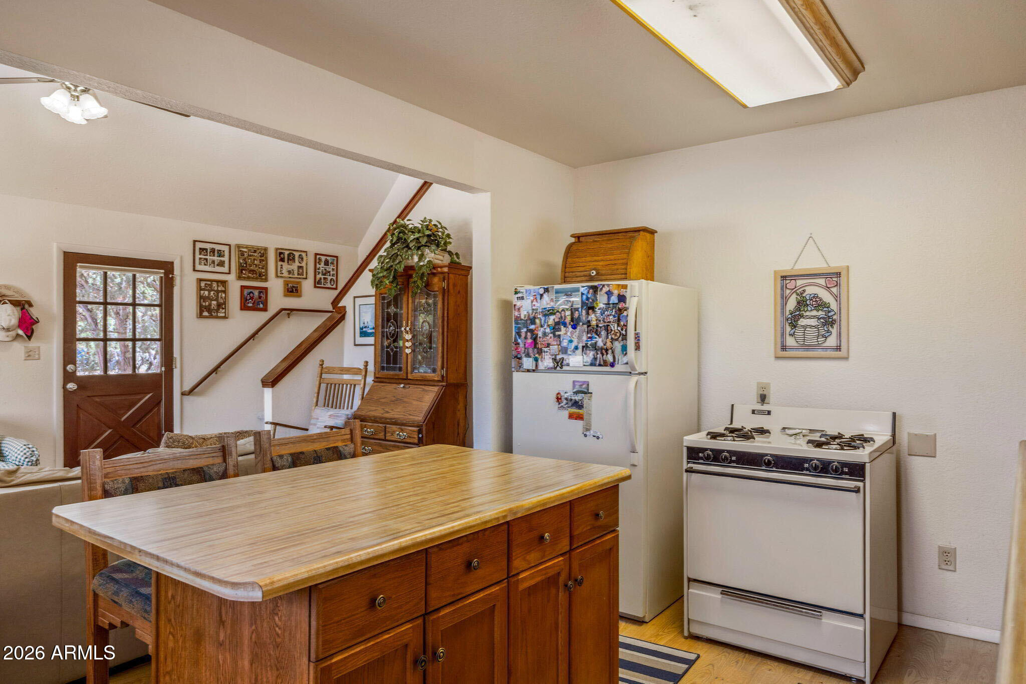 3475 Roundup Circle Heber, AZ 85928 - Photo 11 of 34 a kitchen with appliances cabinets and wooden floor