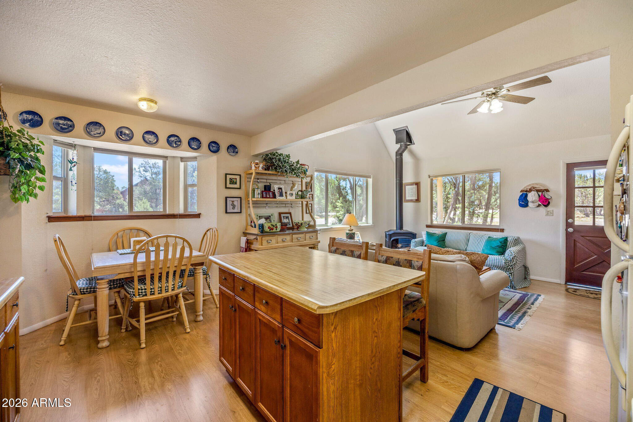 3475 Roundup Circle Heber, AZ 85928 - Photo 12 of 34 a view of a dining room with furniture and wooden floor
