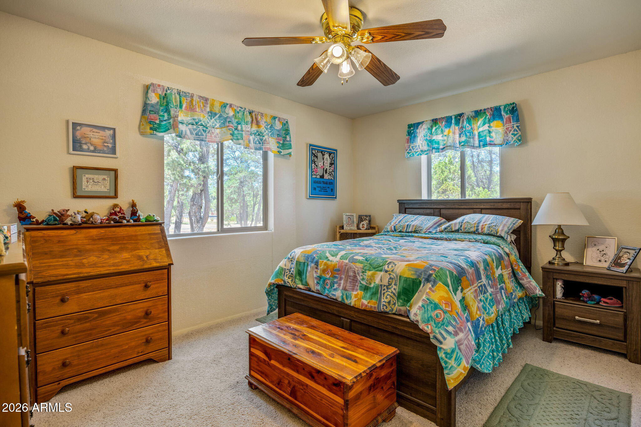 3475 Roundup Circle Heber, AZ 85928 - Photo 13 of 34 a bedroom with a bed a dresser next to a window