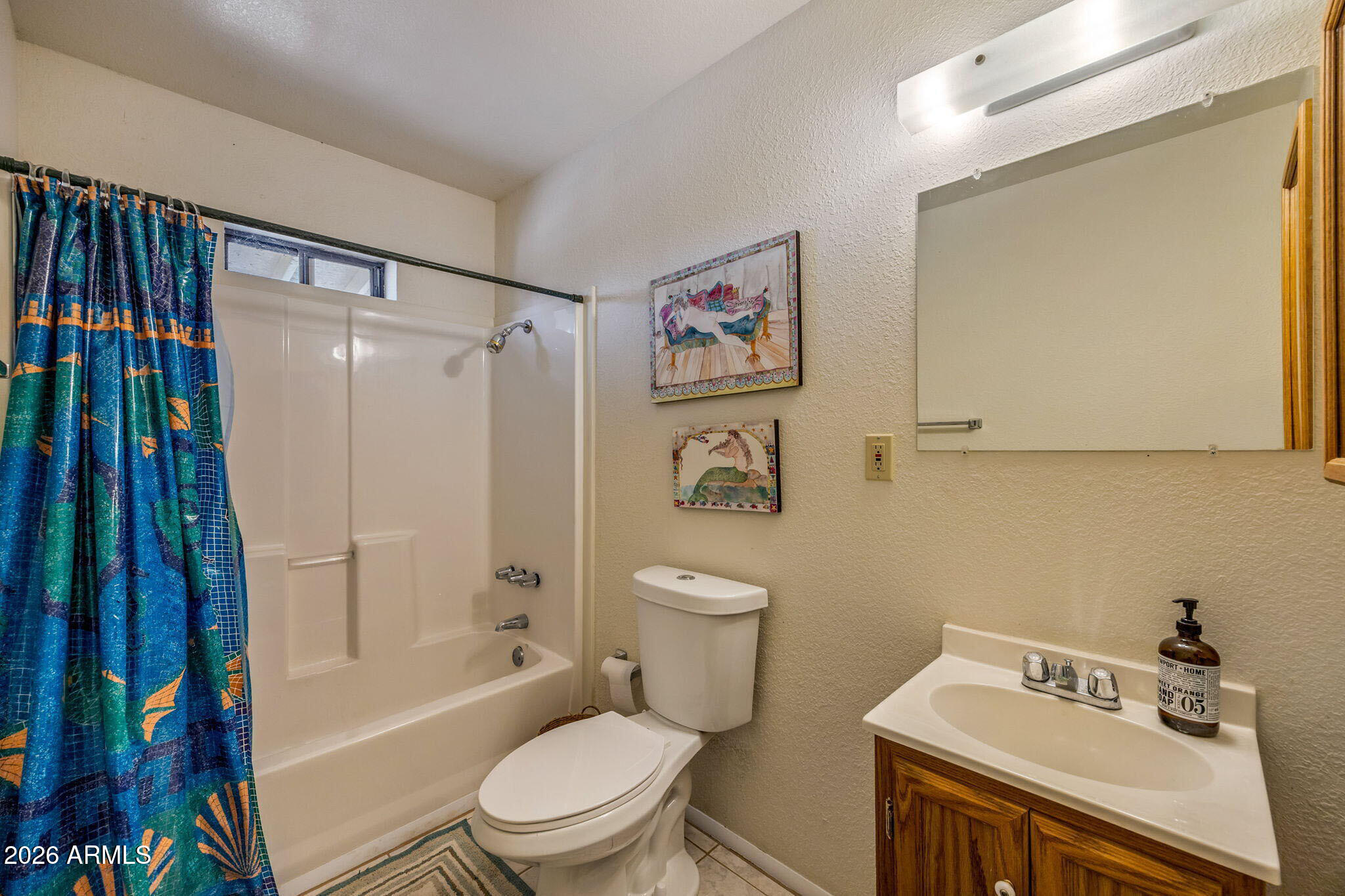 3475 Roundup Circle Heber, AZ 85928 - Photo 14 of 34 a white toilet sitting next to a bathroom sink and a shower
