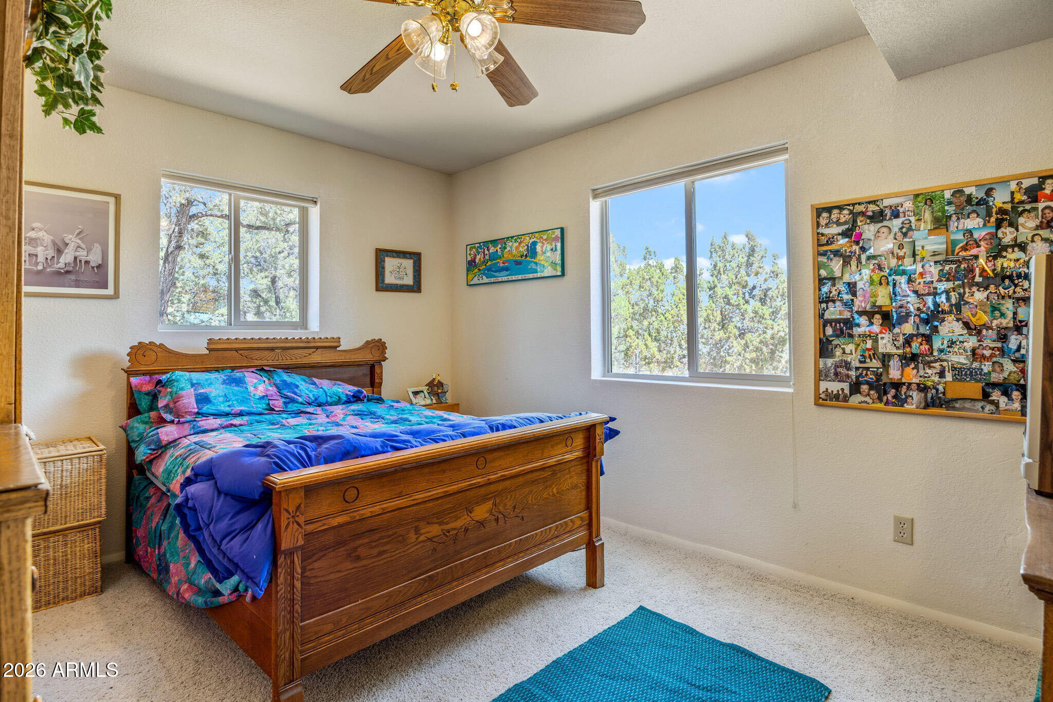 3475 Roundup Circle Heber, AZ 85928 - Photo 15 of 34 a bed sitting in a bedroom next to a window