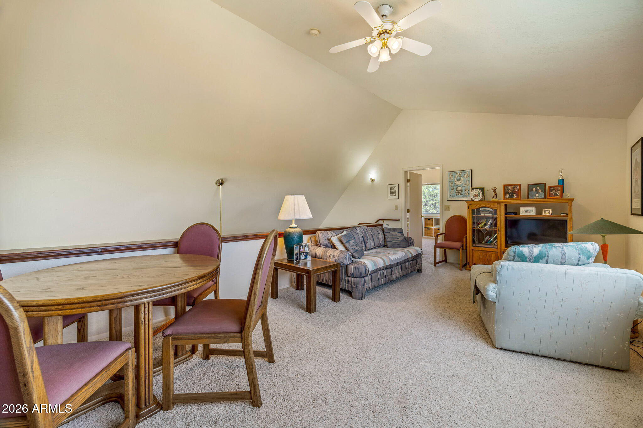 3475 Roundup Circle Heber, AZ 85928 - Photo 17 of 34 a living room with furniture and a chandelier