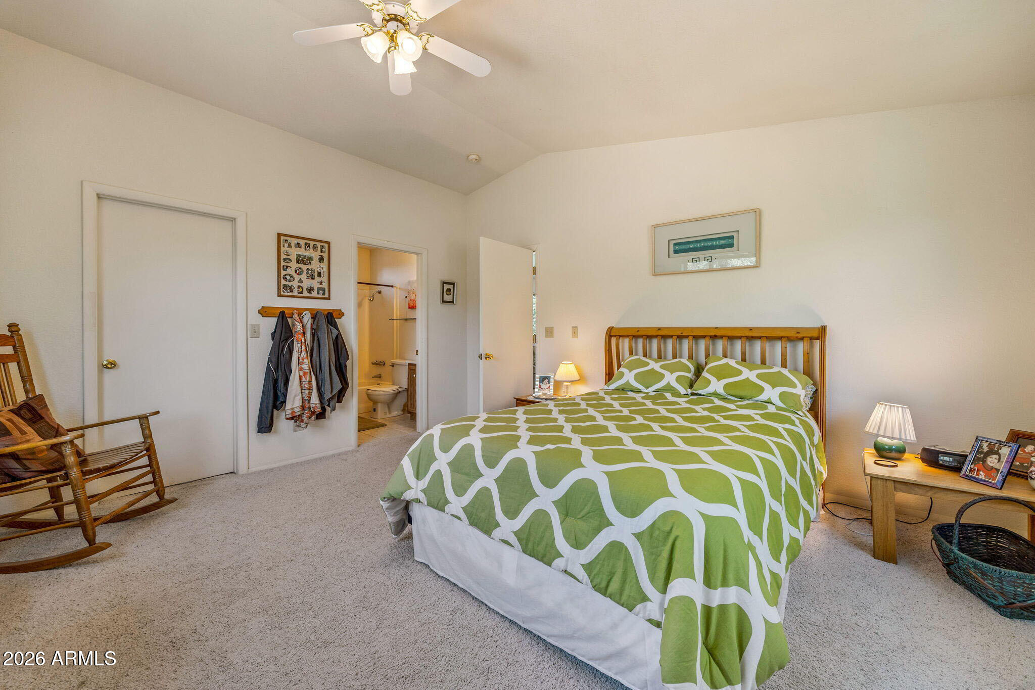 3475 Roundup Circle Heber, AZ 85928 - Photo 18 of 34 a bedroom with a bed and a chandelier