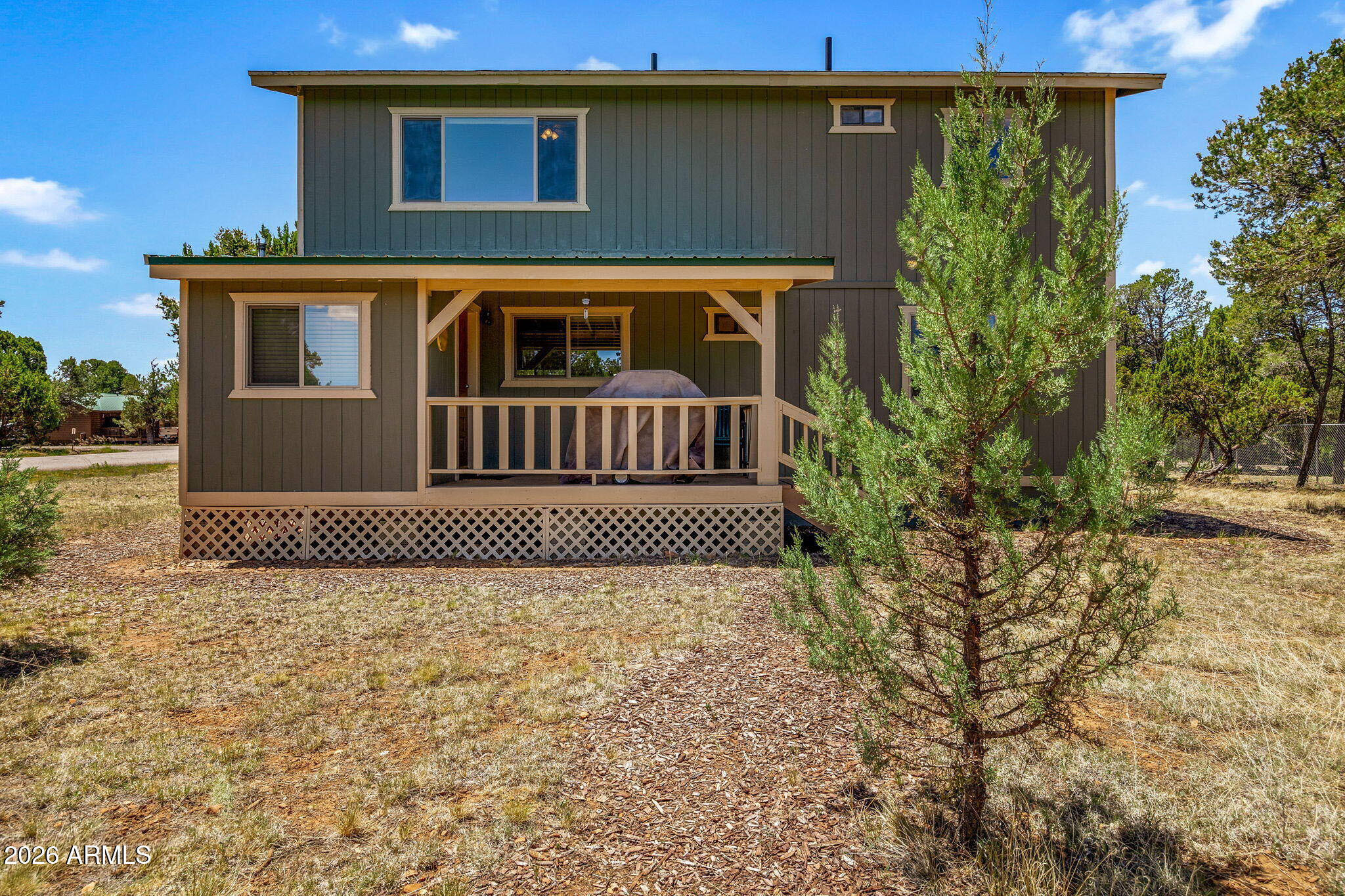 3475 Roundup Circle Heber, AZ 85928 - Photo 23 of 34 a front view of a house with a yard