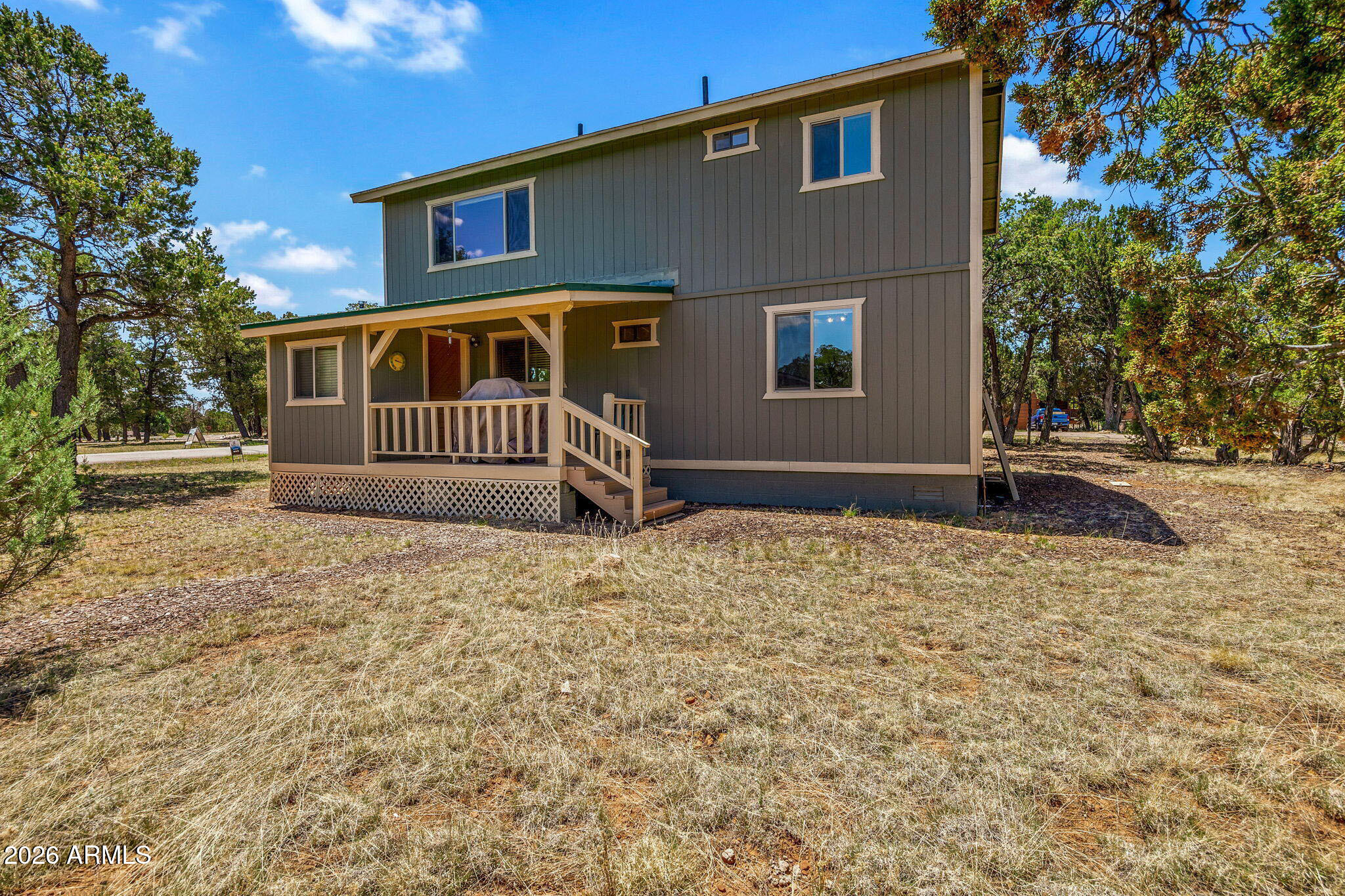 3475 Roundup Circle Heber, AZ 85928 - Photo 24 of 34 a front view of a house with a yard