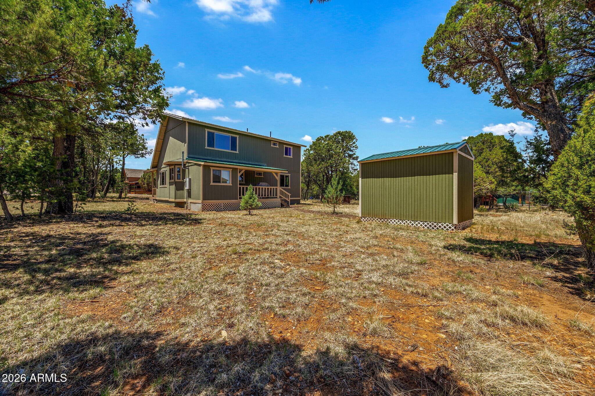 3475 Roundup Circle Heber, AZ 85928 - Photo 25 of 34 a front view of a house with a yard